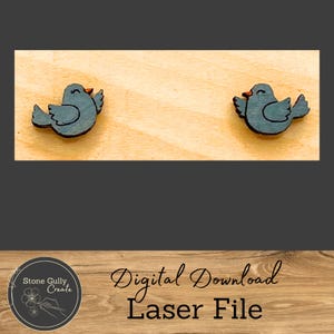 May include: Two laser cut wooden bird shapes, painted blue with a red beak, on a light wood background. The text "Digital Download Laser File" is below the birds.