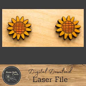 May include: Two laser cut wooden sunflower earrings in a yellow and orange colour scheme. The earrings are on a light wood background. Digital Download Laser File.