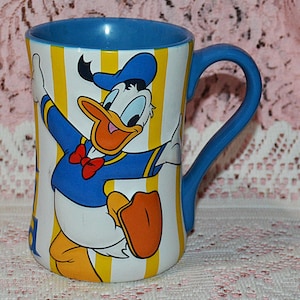 Disney Store Exclusive Donald Blue and Yellow 12 oz Coffee Cup Mug - Very Nice Condition - Microwave and Dishwasher Safe - Donald Duck