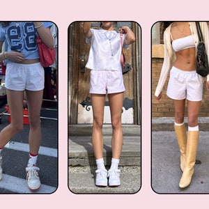 Puede incluir: Tres mujeres con pantalones cortos deportivos blancos y diferentes blusas. La mujer de la izquierda lleva una camiseta azul y blanca con el n&uacute;mero 88. La mujer del centro lleva una camisa con estampado rosa y blanco. La mujer de la derecha lleva un top blanco y una chaqueta blanca.