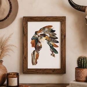 May include: A rectangular wall art print in a dark brown wooden frame featuring a silhouette of a person wearing a large feathered headdress. The headdress is composed of various brown, tan, white, and dark green feathers with intricate patterns.