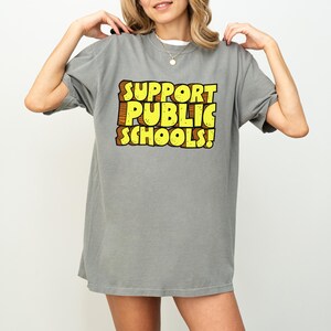 Public School Support Shirt Teacher Rally Wear Comfort Colors Cotton Professional Education Advocate Statement Teaching Community Unity Message Protest March Essential Teacher Movement Support Quality Construction Soft Material Durable