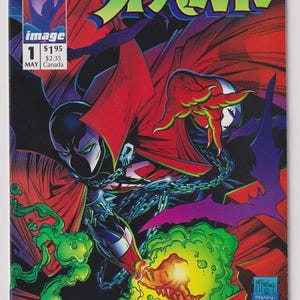 May include: A comic book titled Spawn number 1, dated May, featuring a character in a black suit with a red cape, silver chains, and a skull emblem. The character is surrounded by green energy effects against a dark red and black background.