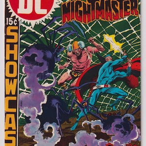 May include: Comic book cover for Showcase #84 featuring Nightmaster. The cover art depicts a battle scene with figures in action, surrounded by large spiders and smoke. The DC Comics logo is visible, along with the text "Come Darkness - Come Death!"
