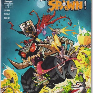 May include: Comic book cover for "Spawn Kills Every Spawn!" featuring a monster truck with a skull-like face, shooting projectiles. The title is in bold red and orange letters against a blue background. The issue number is 1st.
