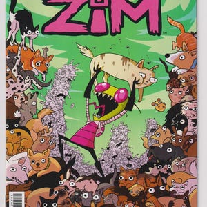 May include: Invader Zim comic book cover featuring the title in pink and green. The image shows Zim holding a dog above a crowd of dogs and cats. The comic book is issue #11.