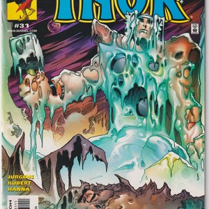 May include: The Mighty Thor comic book issue number 31 features a cover illustration of a figure encased in melting blue ice against a purple and orange cosmic background. The title text reads The Mighty Thor with Marvel Comics branding.