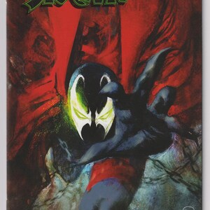 May include: Comic book cover for Spawn #301. The cover features a dark figure with a glowing green and white face, reaching out against a red and black background. The title "Spawn" is in green, with the number "301" in white.
