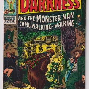 May include: A vintage comic book cover for "Chamber of Darkness" featuring a dramatic illustration. The title is in large red letters on a yellow background. The cover art depicts a monster man walking, with other figures in a spooky setting.