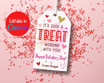 May include: A white gift tag with pink and gold hearts, a watercolor background, and the text "It's such a treat working with you! Happy Valentine's Day! From: Meagan".