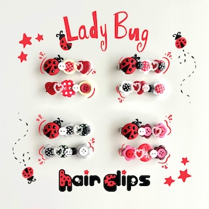 May include: A selection of ladybird-themed hair clips. Each clip features a ladybird design, with decorative buttons and heart-shaped accents in red, white, and black. The words "Lady Bug" and "hair clips" are written in red.