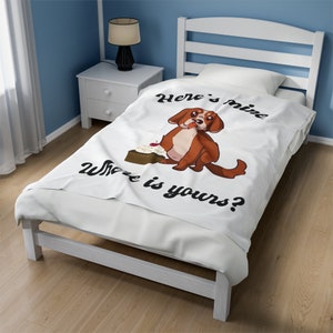 May include: White throw blanket with a brown dog cartoon illustration and the text "Here's mine, Where is yours?"