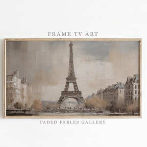 May include: A framed painting of the Eiffel Tower in Paris, France. The painting is done in muted tones of brown, gray, and white. The Eiffel Tower is the focal point of the painting, with buildings and trees surrounding it. The painting is titled "Faded Fables Gallery".