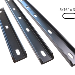May include: Three black metal shelf brackets with a 5/16" x 3/4" profile. The brackets have a U-shaped design with multiple holes for mounting.