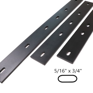 May include: Three black metal strips with evenly spaced holes. The strips are 5/16" x 3/4".