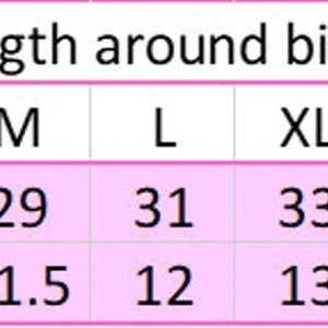 May include: A chart showing the length around the bicep in inches and centimeters for different sizes: XS, S, M, L, XL, 2XL, 3XL, and 4XL.