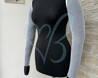 May include: A black mock neck shirt with long sleeves and sheer white mesh sleeves. The sleeves have black trim at the cuffs.