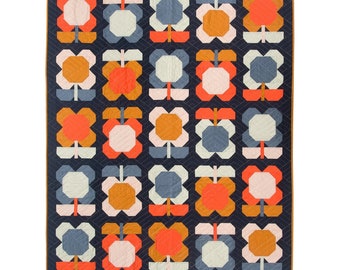 May include: A quilt with a repeating pattern of stylized flowers in shades of orange, pink, blue, and white on a dark blue background.