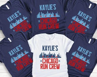 May include: Five navy blue t-shirts with white text that reads "KAYLIE'S 20 CHICAGO 25 RUN CREW" and a blue silhouette of the Chicago skyline. One white t-shirt with the same text and skyline.