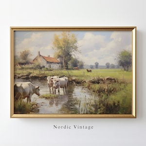 May include: A painting of a rural landscape with a farmhouse, a stream, and cows. The sky is blue with white clouds. The painting is framed in gold.
