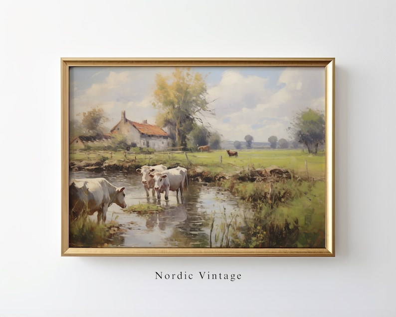 May include: A painting of a rural landscape with a farmhouse, a stream, and cows. The sky is blue with white clouds. The painting is framed in gold.