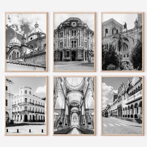 May include: Six framed black and white photographs of architectural landmarks. The images include churches, cathedrals, and buildings with intricate details. The photographs are displayed in wooden frames.