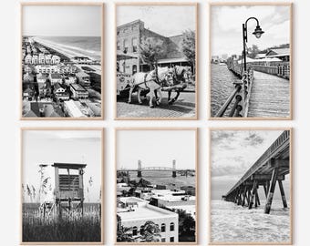 May include: A set of six black and white photographs of various scenes in a coastal town. The photos include a beach, a bridge, a pier, a horse-drawn carriage, and a street scene.