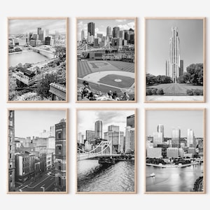 May include: A set of six black and white photographs of Pittsburgh, Pennsylvania. The photos show various landmarks, including the city skyline, a baseball stadium, and a church.