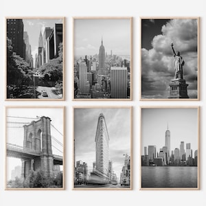 May include: A set of six black and white photographs showcasing iconic landmarks of New York City, including the Empire State Building, the Statue of Liberty, the Brooklyn Bridge, and the Flatiron Building.