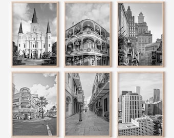 May include: A set of six black and white photographs of New Orleans, Louisiana. The photos feature various architectural details, including a cathedral, balconies, and street scenes.