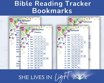 May include: Two printable Bible reading tracker bookmarks with floral designs. The bookmarks feature a grid with days of the month and chapters from the Old Testament books of Genesis and Job. The text "She Lives in Light" is at the bottom of the bookmarks.