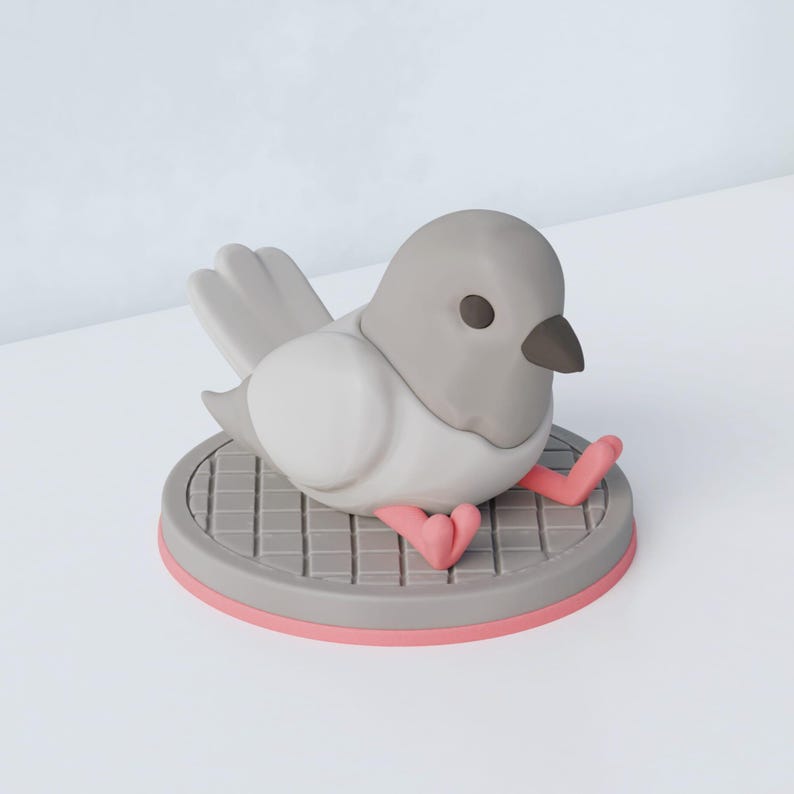 May include: A gray and white bird figurine with a dark beak and eyes, perched on a gray platform with a pink rim. The bird's pink feet are visible. The figurine has a cartoonish design.