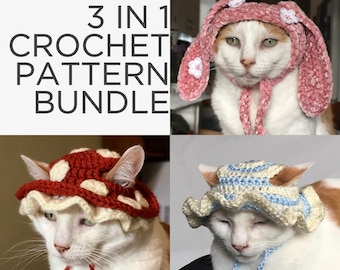 May include: Three crochet cat hats in a bundle. The hats are a pink bunny hat, a red and white mushroom hat, and a blue and white sun hat. Each hat is worn by a white cat.