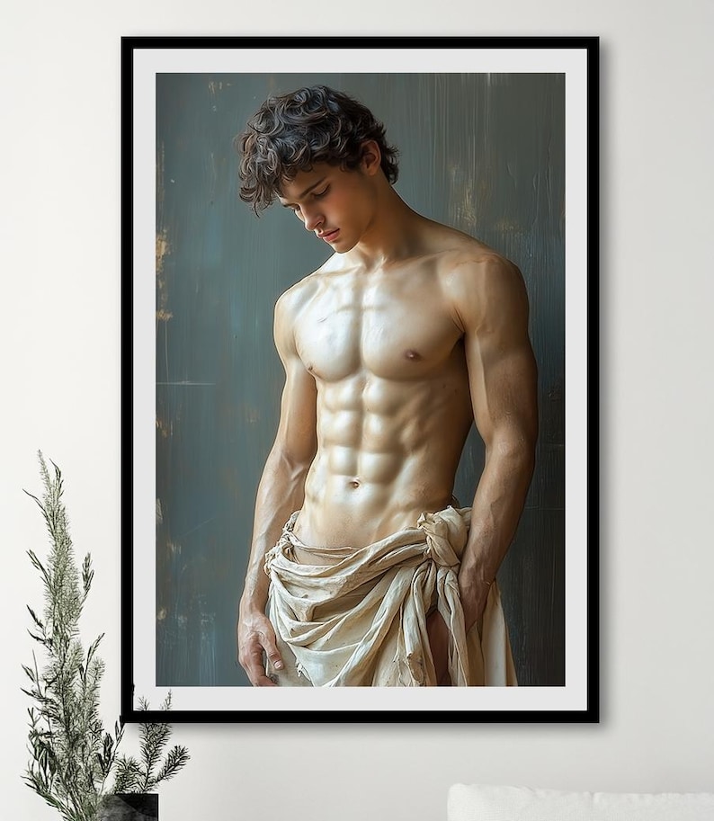 May include: A muscular man with short, dark hair poses in a studio setting. He is wearing a white cloth draped around his waist. The background is a textured, dark green wall.