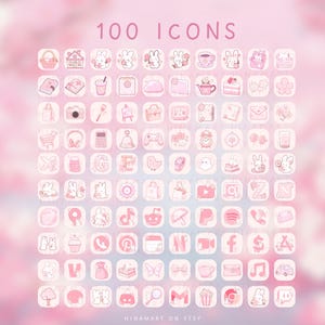 May include: A set of 100 pink and white app icons featuring illustrations of bunnies, flowers, and food. The text "100 Icons" is at the top. The background is a soft, blurred pink.