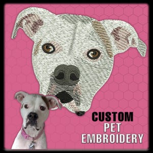 May include: A pink background with a white and gray embroidered dog face and a photograph of a dog. The text "CUSTOM PET EMBROIDERY" is in black. The embroidered dog has brown eyes and a black nose.