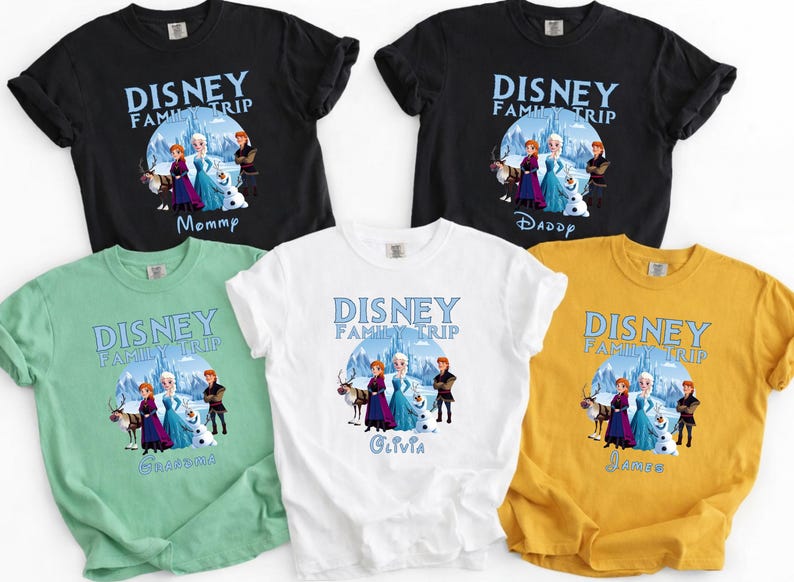 May include: A collection of short-sleeved t-shirts in black, white, green, and yellow. Each shirt features a Disney Family Trip graphic with characters from Frozen and personalized names like "Mommy," "Daddy," "Olivia," and "James."