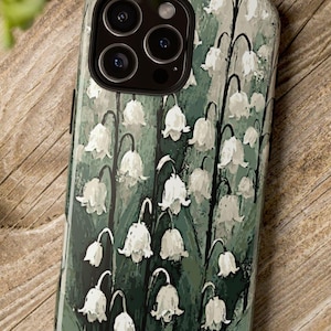 Lily of the Valley Artwork Phone Case. Delicate impressionistic white bell-shaped flowers against a green leaf background. Many phone models