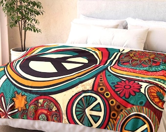 Peace Sign Fleece Sherpa Blanket. Featuring a vibrant hippie era 1960s inspired design with bold peace symbols and floral accents. 2 sizes.