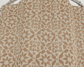 Moroccan Star Tile Cloth Shower Curtain. Featuring a softly worn geometric star and lattice pattern in warm desert brown neutrals on beige.