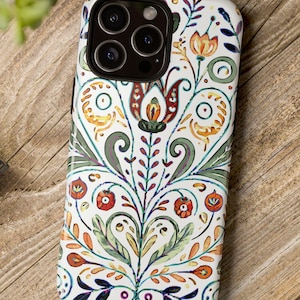 Scandinavian Folk Art Phone Case. A floral motif inspired by traditional rosemaling and Eastern European folk embroidery. Many phone models.