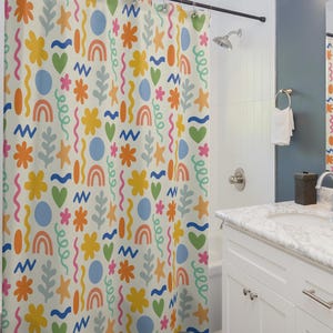 May include: A colorful shower curtain with a repeating pattern of abstract shapes, flowers, and wavy lines in shades of blue, yellow, orange, green, and pink on a white background.