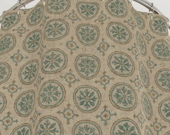 Worn Moroccan Tile Cloth Shower Curtain. Featuring teal green circular medallion motifs layered over a softly distressed sand background.
