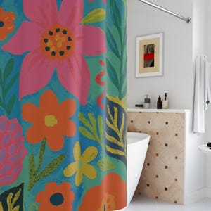May include: A shower curtain with a colorful floral pattern. The design features large pink, orange, and yellow flowers on a blue background. The flowers are surrounded by green leaves and stems.