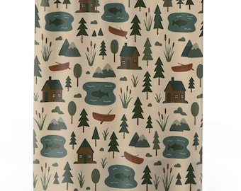 May include: Shower curtain with a repeating pattern of cabins, trees, lakes with fish, mountains, and canoes in shades of brown, green, and blue on a beige background. The curtain is hanging from a metal rod.