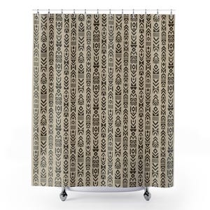 May include: A beige shower curtain with a repeating pattern of dark brown geometric shapes. The design includes arrows, diamonds, and other abstract forms arranged in vertical stripes. The curtain hangs from a metal rod.