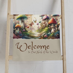 Mushroom Forest Welcome Hand Towel. Mystical scene of towering mushrooms nestled ina vibrant forest. Welcome to Our Neck of the Woods.