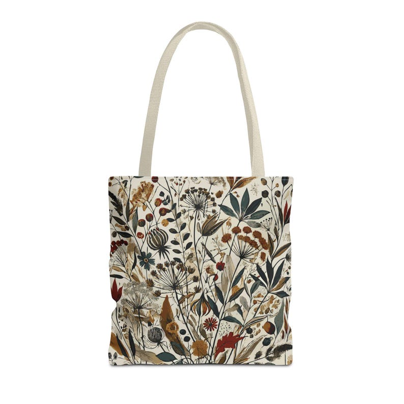 Whimsical Botanical Tote Bag. Featuring an intricate, unique and artistic design of various flowers, leaves, and branches in earthy tones.