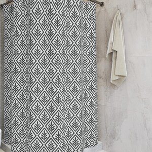 Charcoal Botanical Diamond Shower Curtain. A distressed repeating pattern of diamond shapes, each framing a sketched botanical sprig.