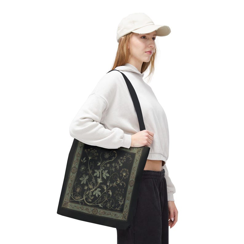 Vintage Inspired Botanical Tote Bag. A tapestry-inspired border frames olive green wildflowers and vines on black. 3 sizes, 2 strap colors.